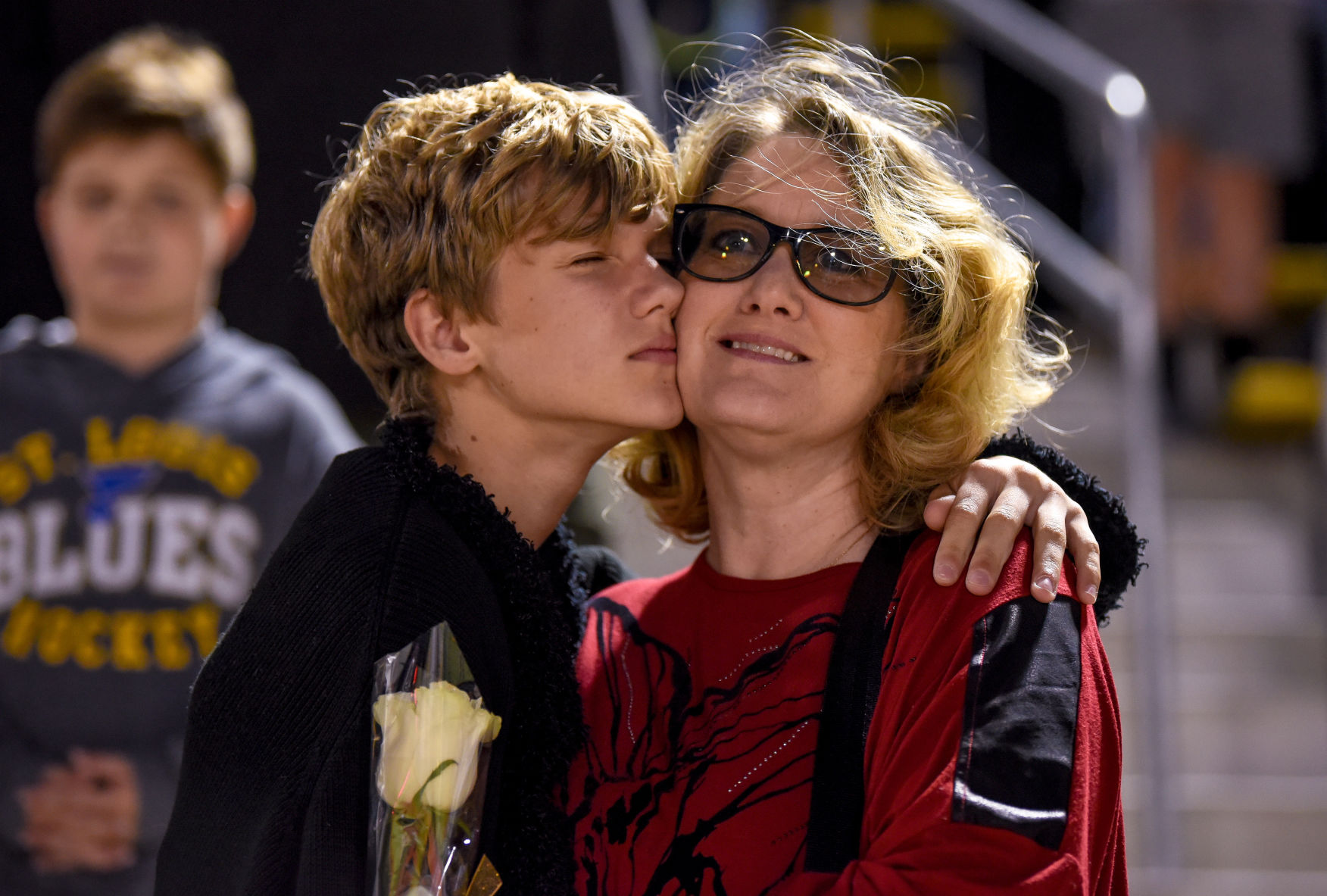 Jack Ewers, 13, leans on his mother Tam Ewers